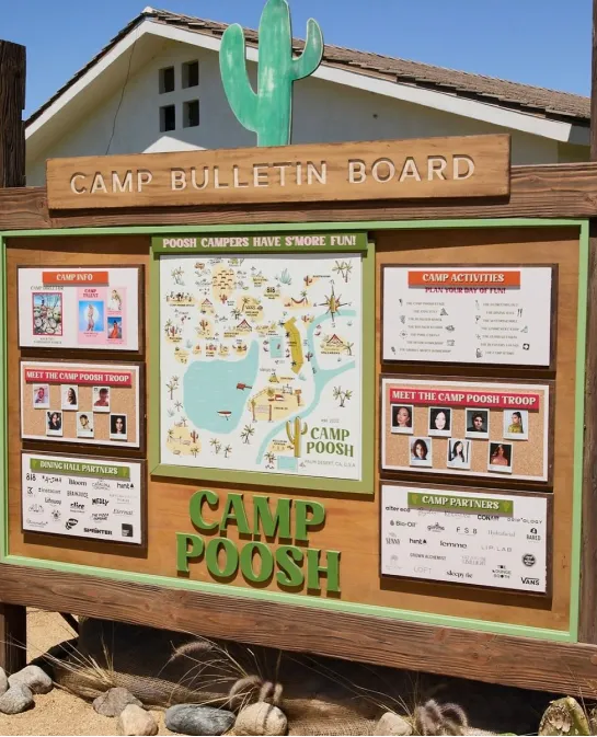 Camp Poosh bulletin board sign with a cactus cutout and camp map